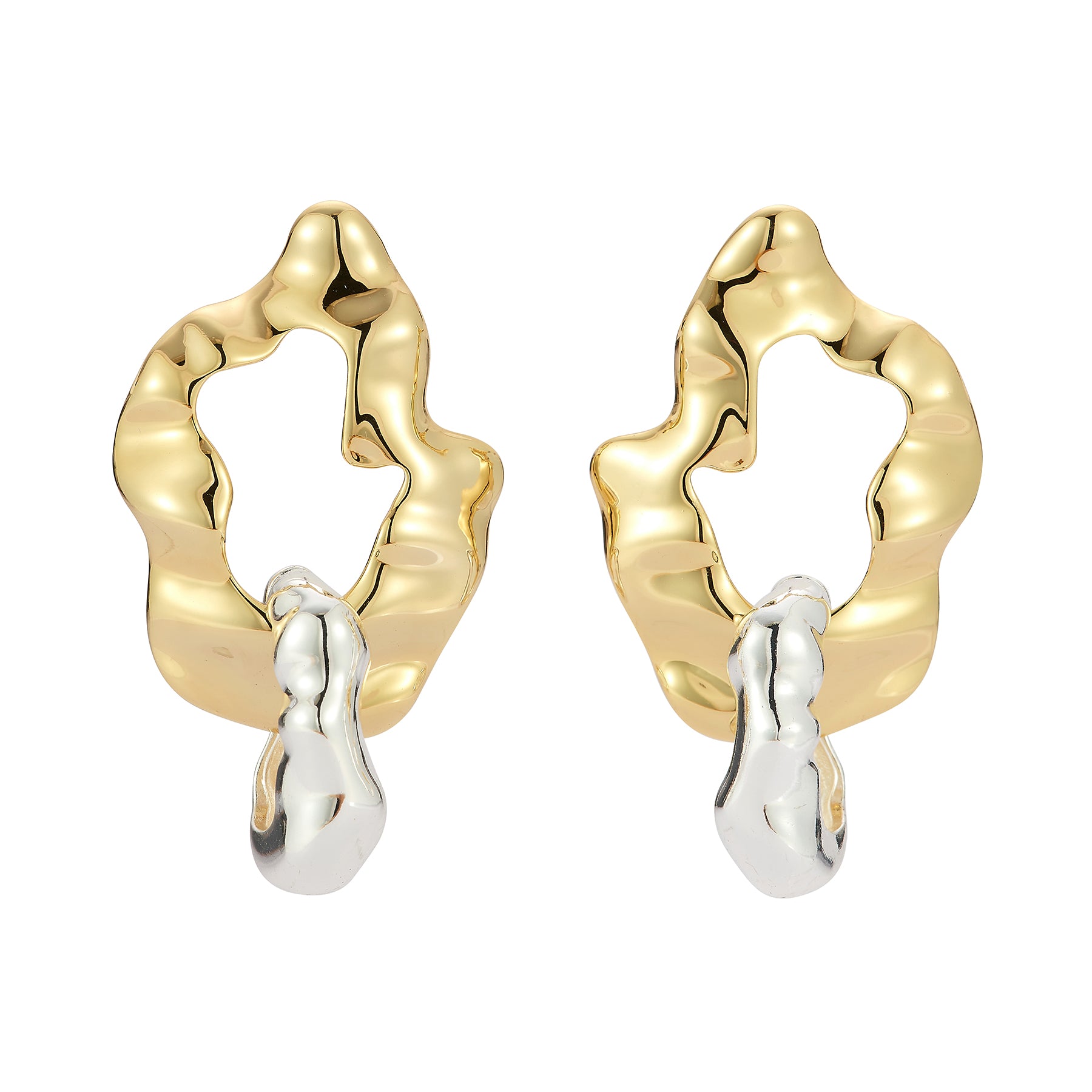 Gold and silver earrings on a white background