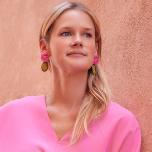Embroidered and Beaded Pink Flower Cactus Drop Earrings Styled on Maggie in Pink Outfit Against Clay Wall