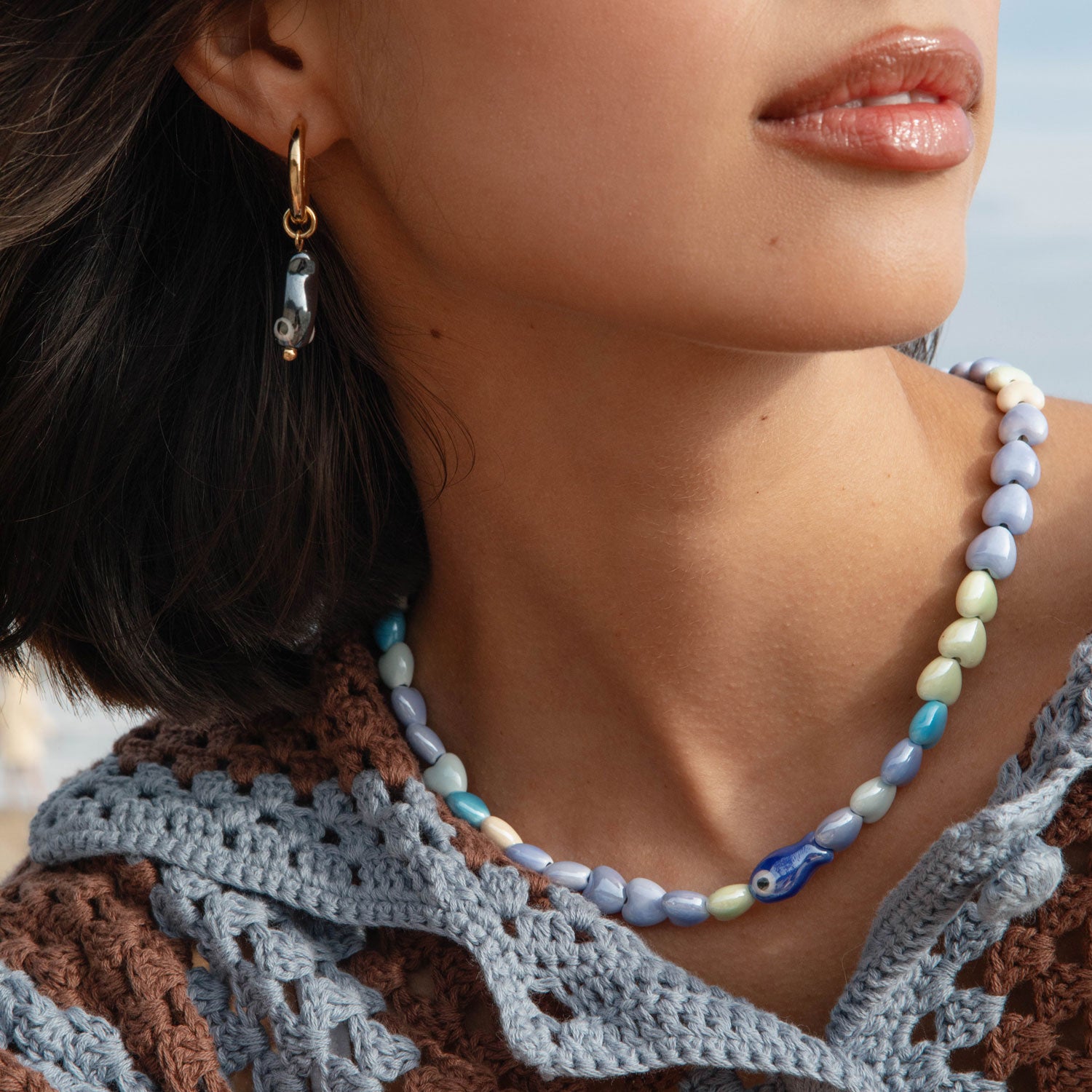 Beaded Heart and Fish Necklace Styled on Models Neck