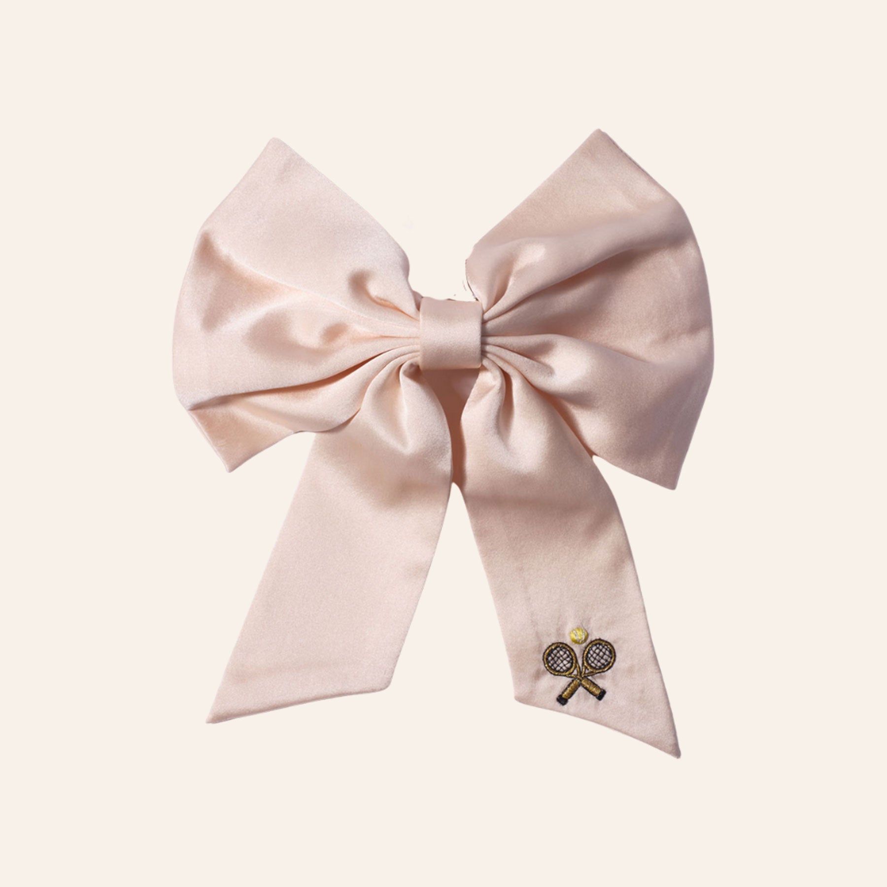 Cream Silk and Tennis Racket Embroidered Hair Bow on Tan Background