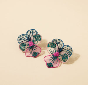 Embroidered Pink Blue and Green Flower Stud Earrings On Flat Cream Background
