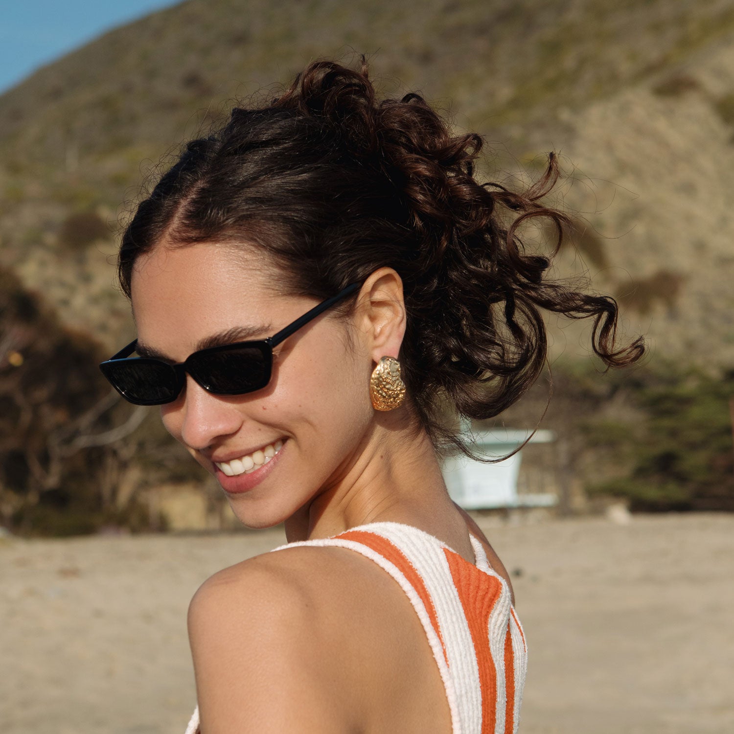Gold Oyster Shell Stud Earrings Styled on Model