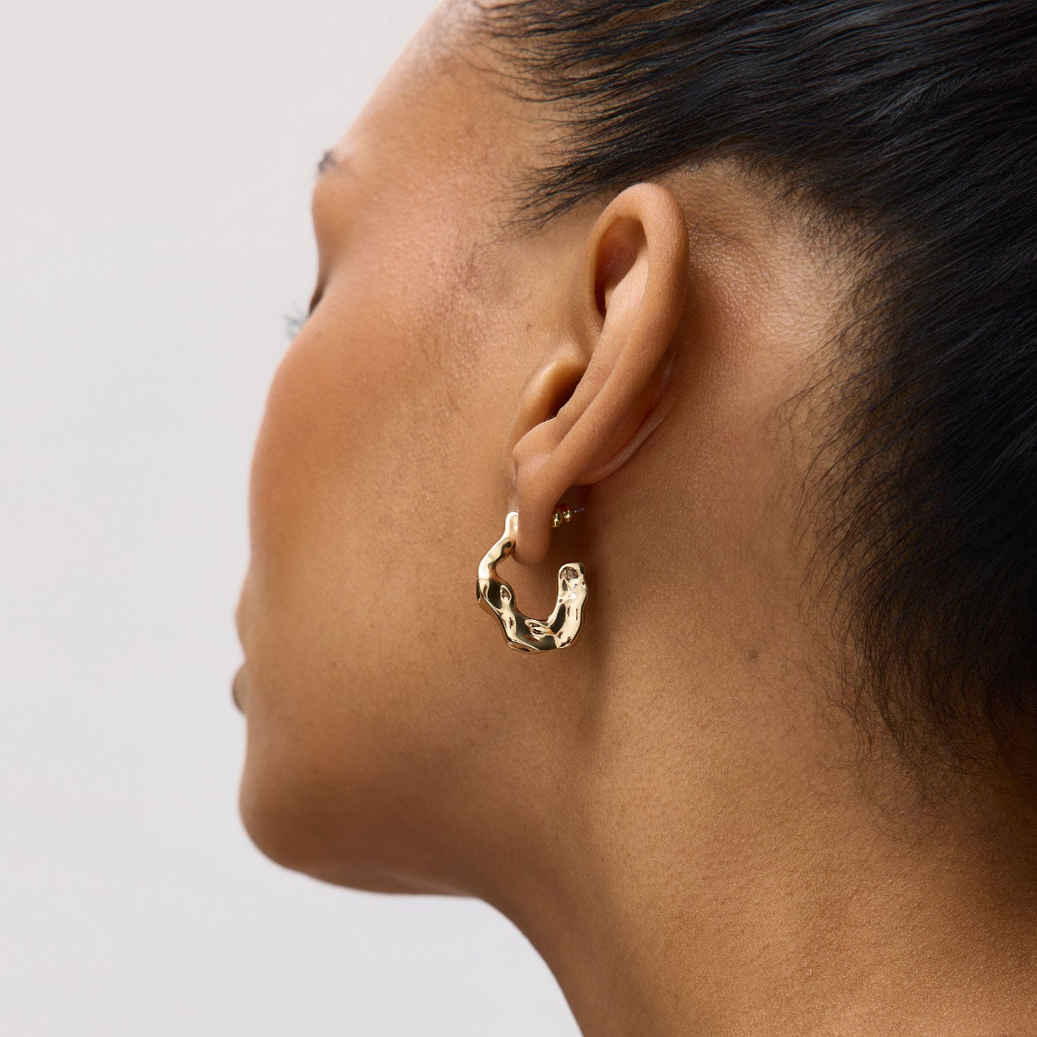 Organic Shaped Gold Hoop Earrings Styled on Model