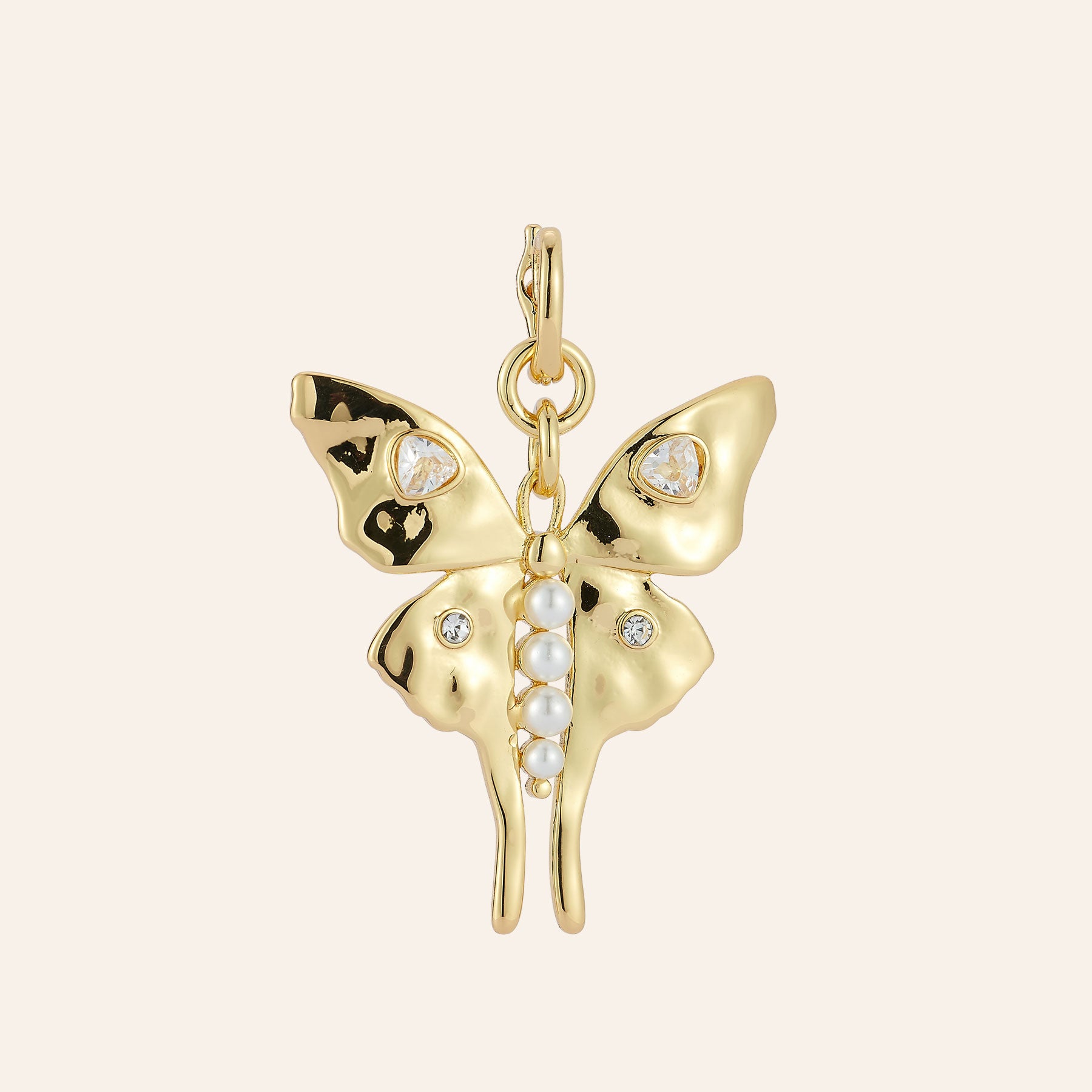 Gold, Pearl, and Crystal Butterfly Charm on Tan Background