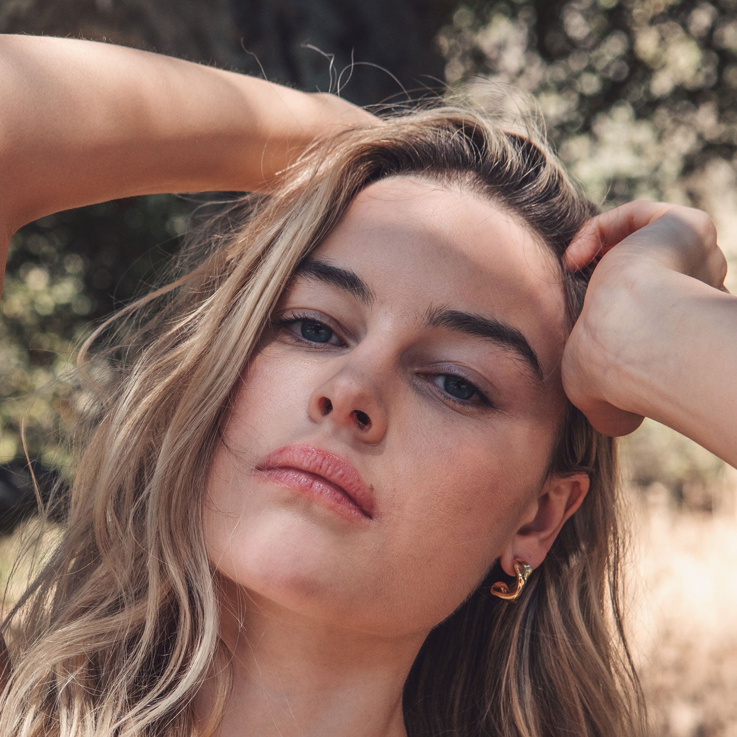 Gold Stud Earrings Styled on Model