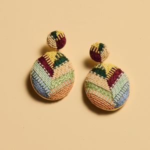 Multi-Colored Beaded Double Drop Earrings on Tan Background
