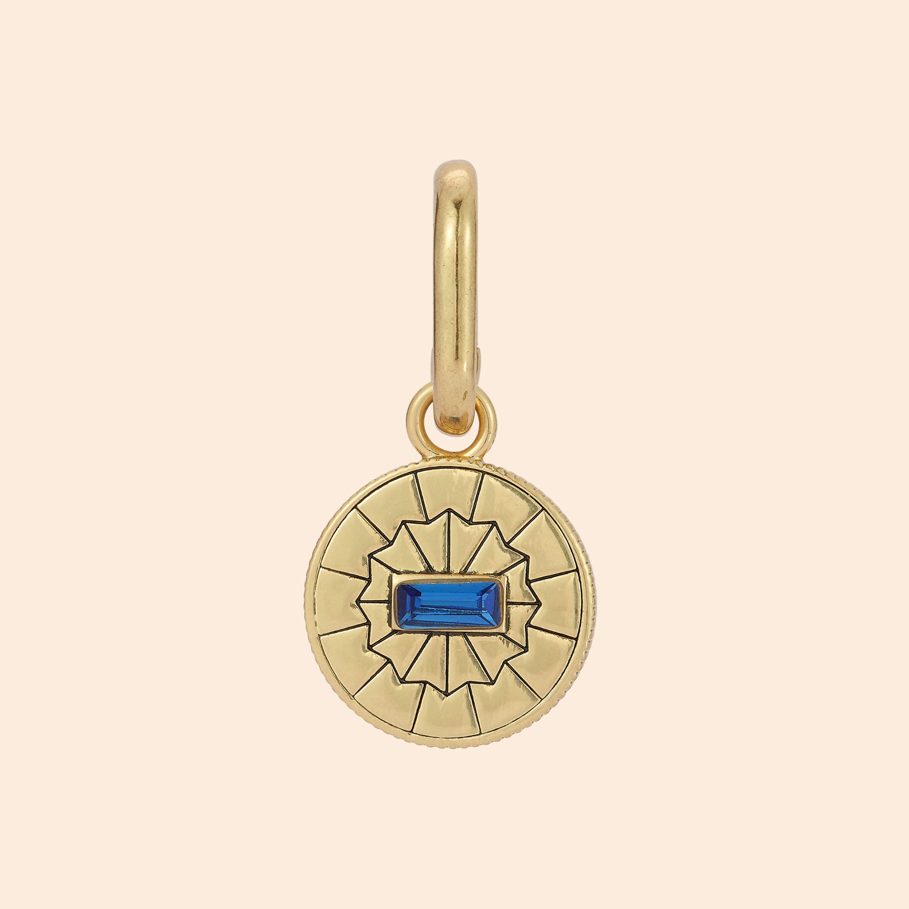 Navy Crystal and Gold Charm on Tan Background