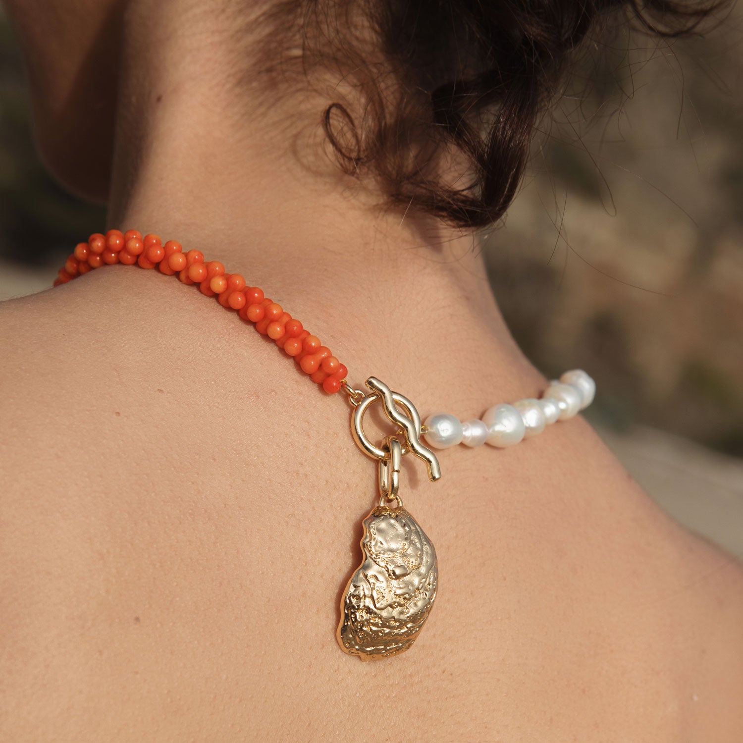 Orange Bead and Freshwater Pearl with Gold Oyster Shell Charm Pendant Necklace Styled on Model