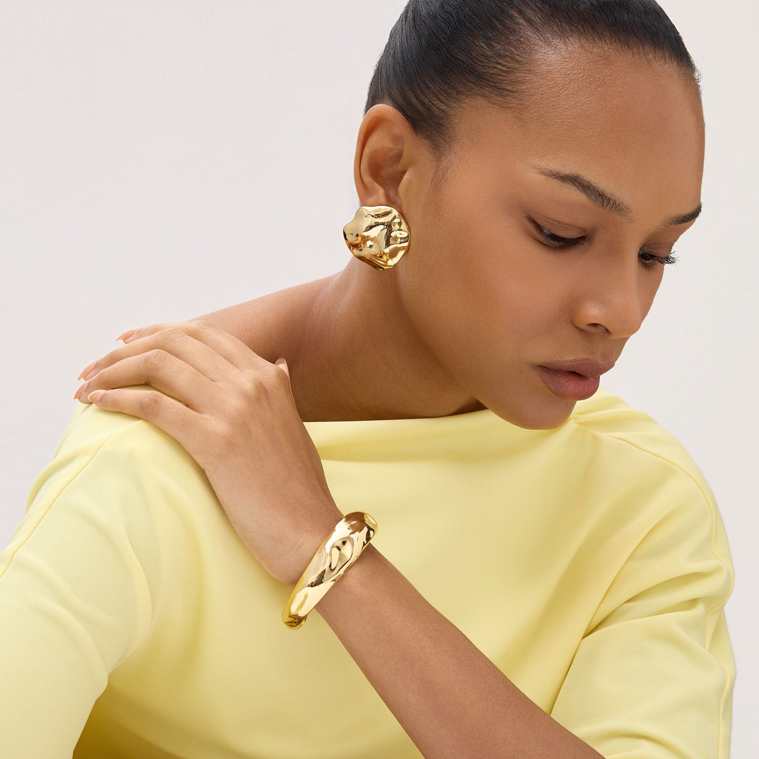 Gold Round Stud Earrings Styled on Model