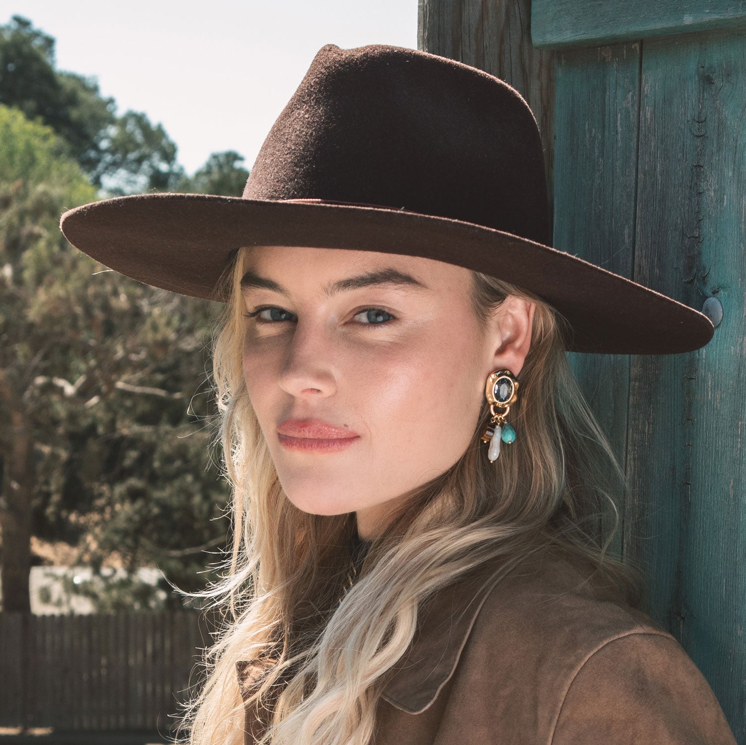 Gold, Pink and Blue Crystal Charm Drop Earrings Styled on Model
