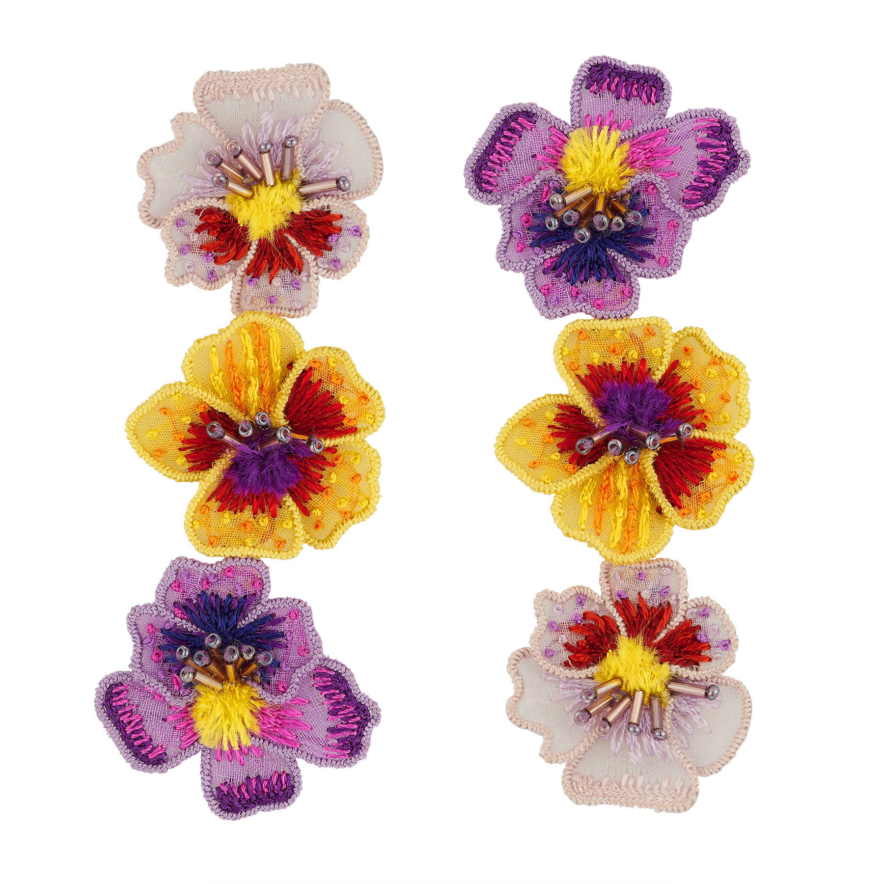 Floral shaped embroidered earrings on white background