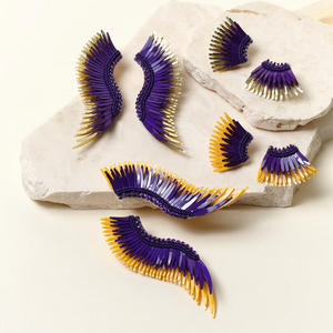 madeline winged earrings mini and full size in two color variations of purple and gold