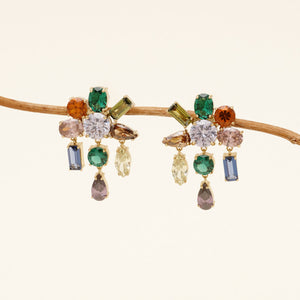 a pair of crystal earrings featuring nine crystals of different colors on each earring dangling from a thin branch