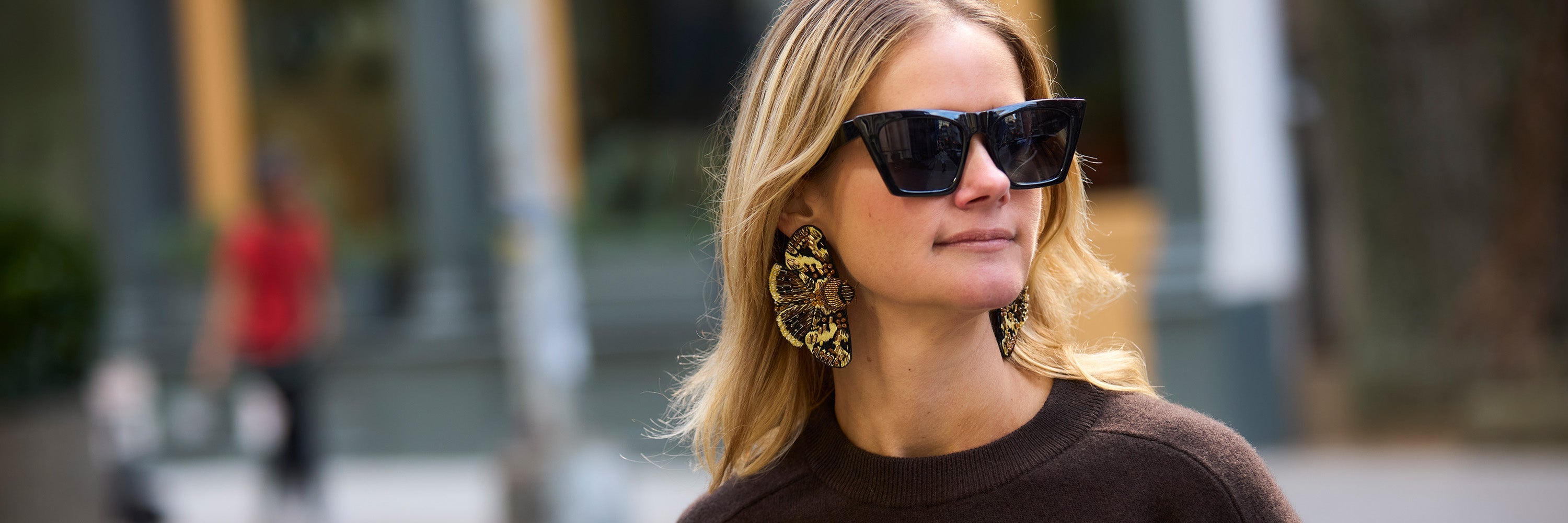 Mignonne Wearing Mini Brown Owl Earrings