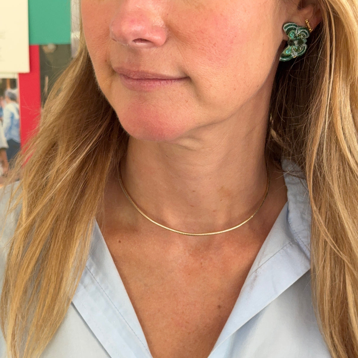 Gold-tone herringbone necklace featuring a delicate chain, adjustable extender, and gold hook clasp on Mignonne Gavigan