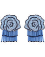 A pair of statement earrings made from matchsticks, featuring a circular floral design in light blue, white, and black, with long blue matchstick tails hanging below, shown on a plain white background.