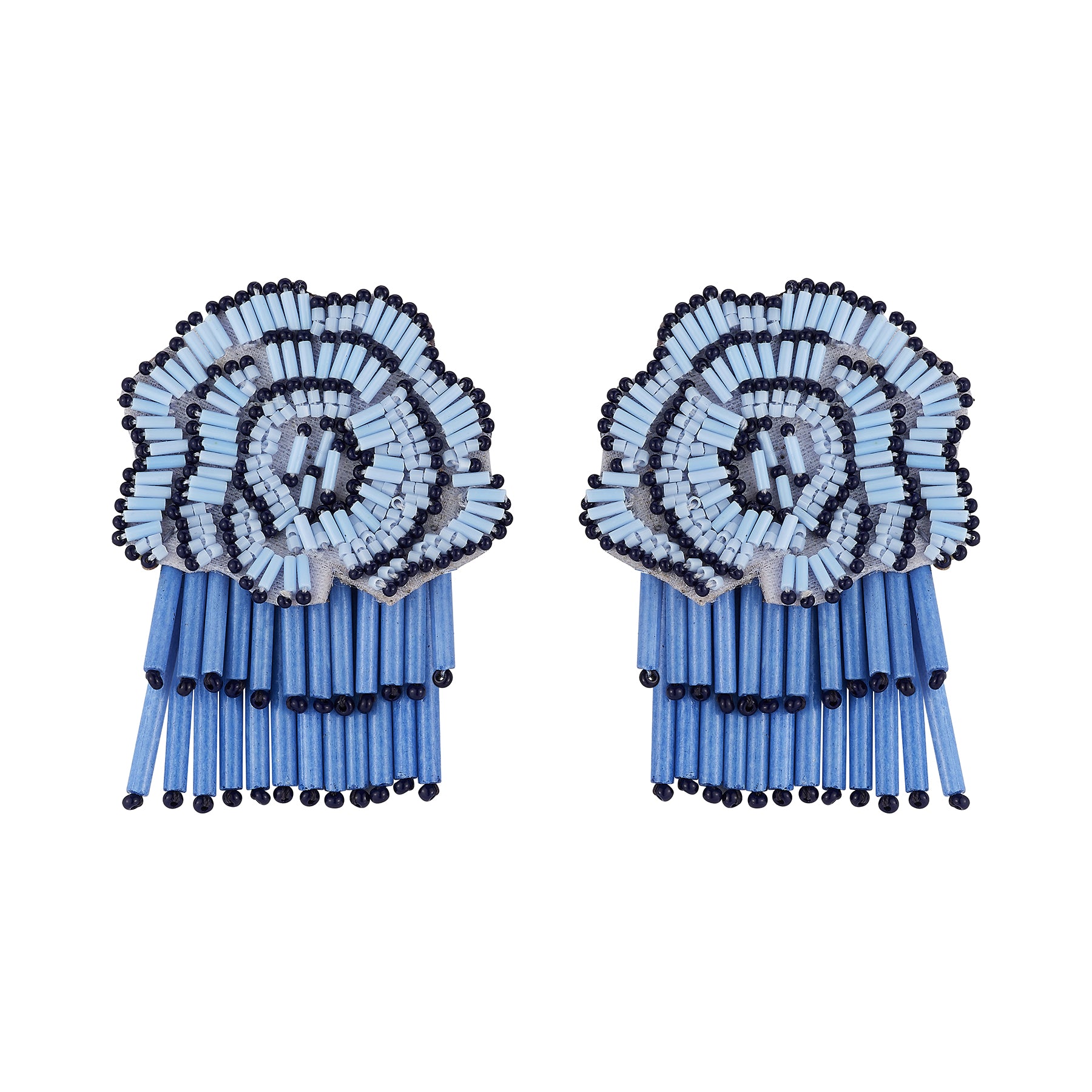 A pair of statement earrings made from matchsticks, featuring a circular floral design in light blue, white, and black, with long blue matchstick tails hanging below, shown on a plain white background.