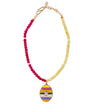 Necklace with pink and yellow beads and a colorful egg-shaped pendant on a white background