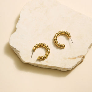 Antiqued Gold Rope Hoop Earrings on Natural Stone with Flat Cream Background