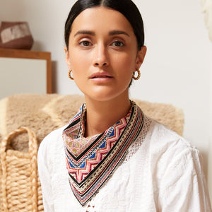Gold Rope Hoops on Model with Bandana and White Shirt with Living Room Furniture in Background