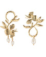 A pair of gold-toned floral dangle earrings with textured leaf and flower motifs and small white pearl drops, shown on a plain white background.