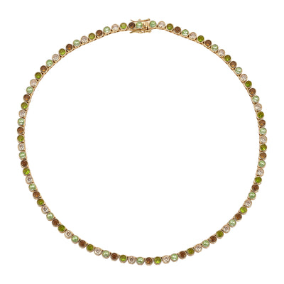 Green and brown tennis necklace against a white background