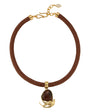 A brown braided cord necklace with a gold-tone clasp and a central gold-tone pendant featuring a dark brown teardrop stone and curved gold accents, shown on a plain white background.