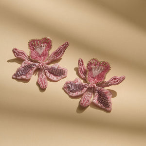 Beaded and Embroidered Light Pink Flower Stud Earrings on Cream Background with Shadows
