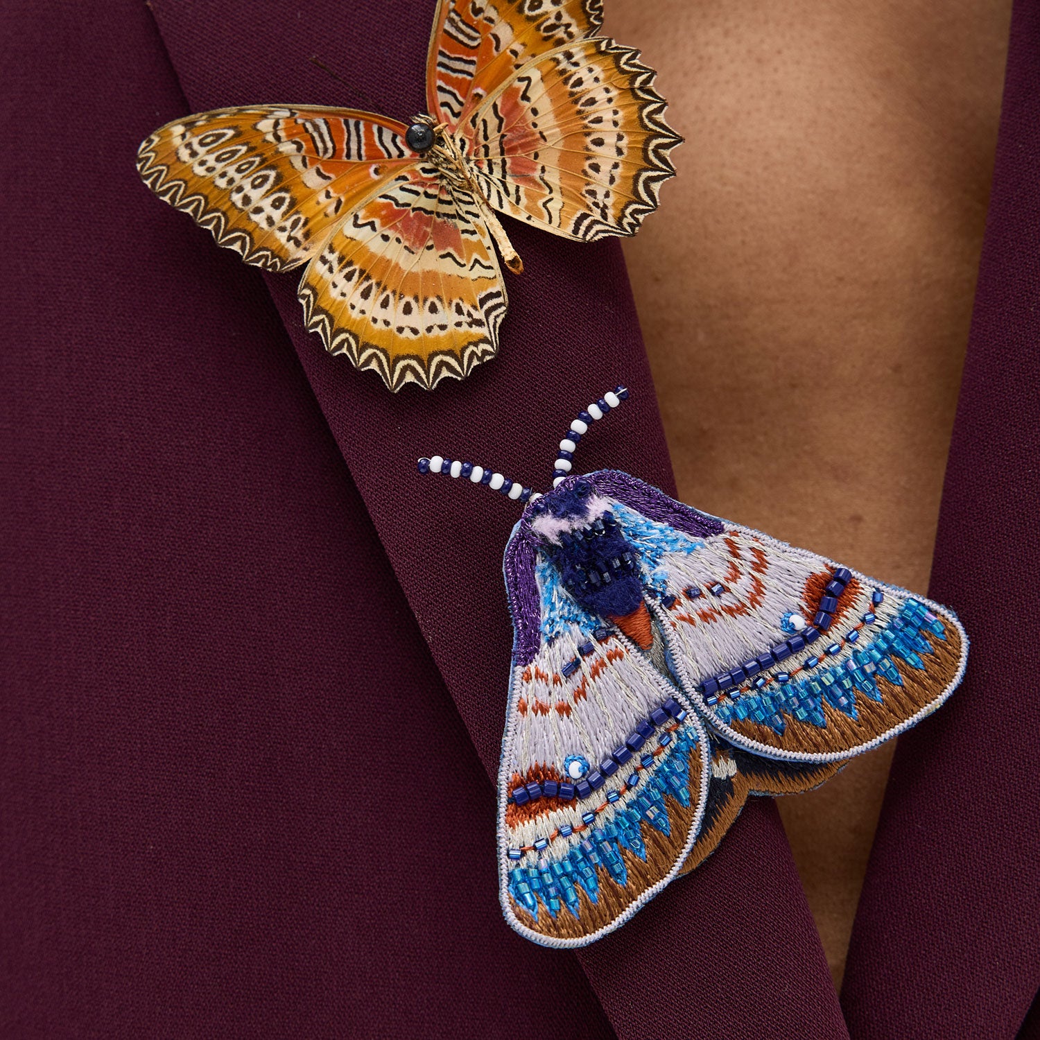 Purple and Blue Bead Embroidered Moth Brooch Styled on Model's Blazer with Butterfly