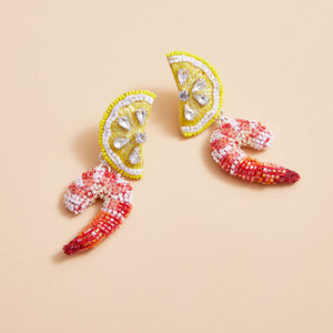 Beaded Lemon and Shrimp Drop Earrings Styled on Cream Background
