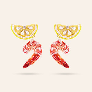 Beaded Lemon and Shrimp Drop Earrings Styled on Cream Background