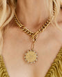 Gold and Crystal Compass Charm Chain Pendant Charm Necklace Styled on Model's Neck