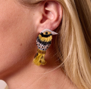 Gold, Silver, and Black Embroidered Bird Stud Earrings on Model's Ear