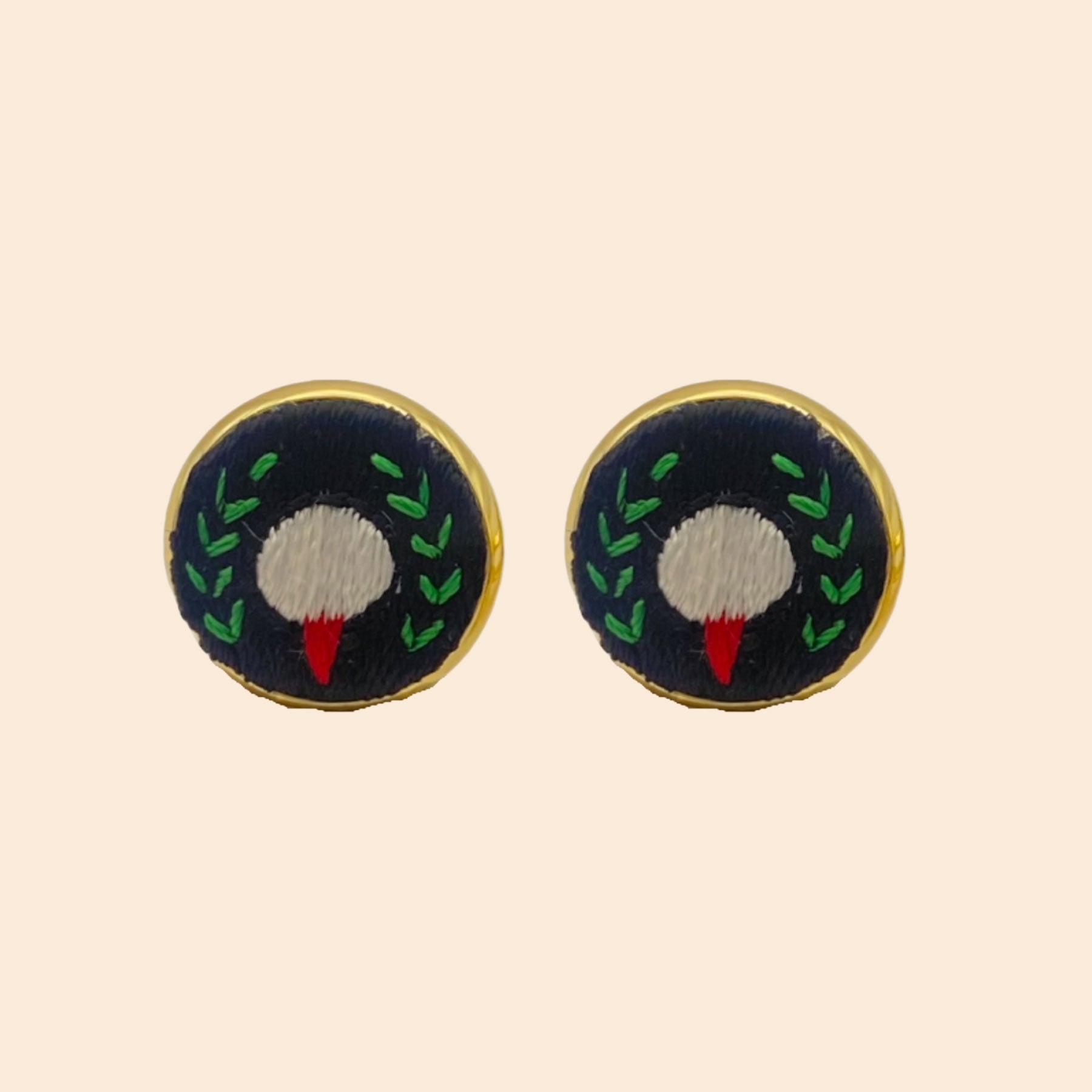 Embroidered Cuff Links on Tan Background