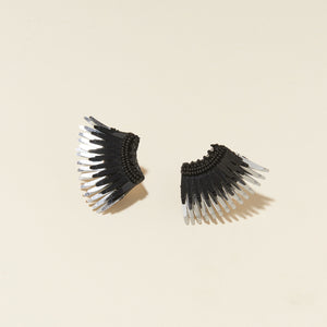 Black and Metallic Silver Sequin and Bead Wing Earrings on Flat Cream Background