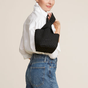 Black Woven Handbag Styled on Model in Jeans and White Shirt