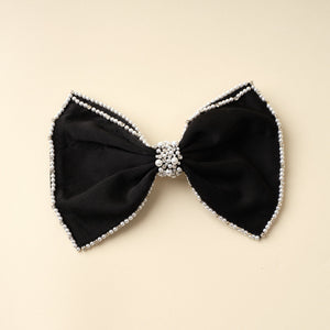 Black Hair Bow with Pearl and Crystal Embroidery on Tan Background