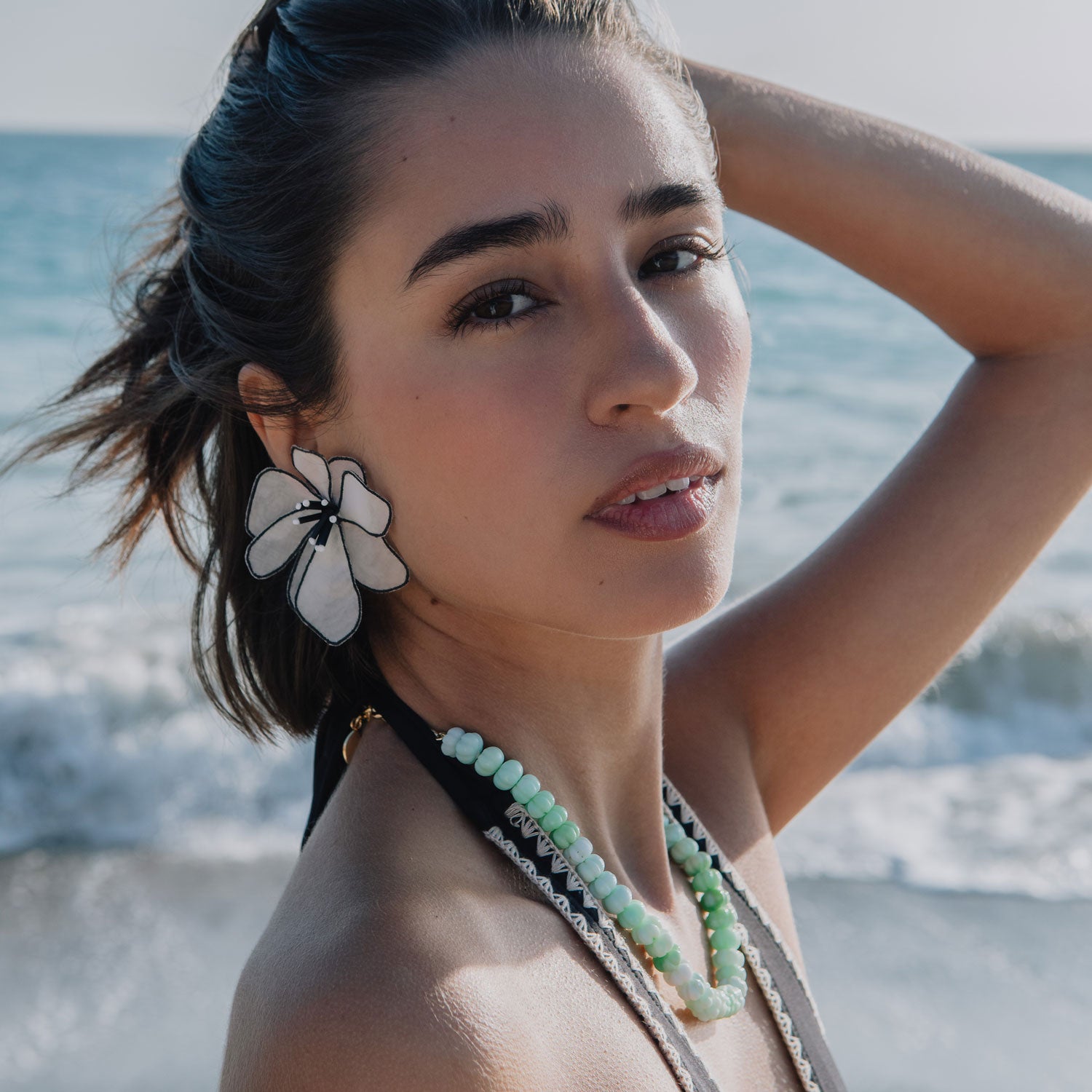 Black and White Embroidered Flower Earrings Styled on Model