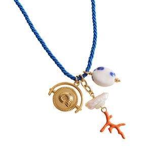 Blue Chord Pendant Charm Necklace on Flat White Background