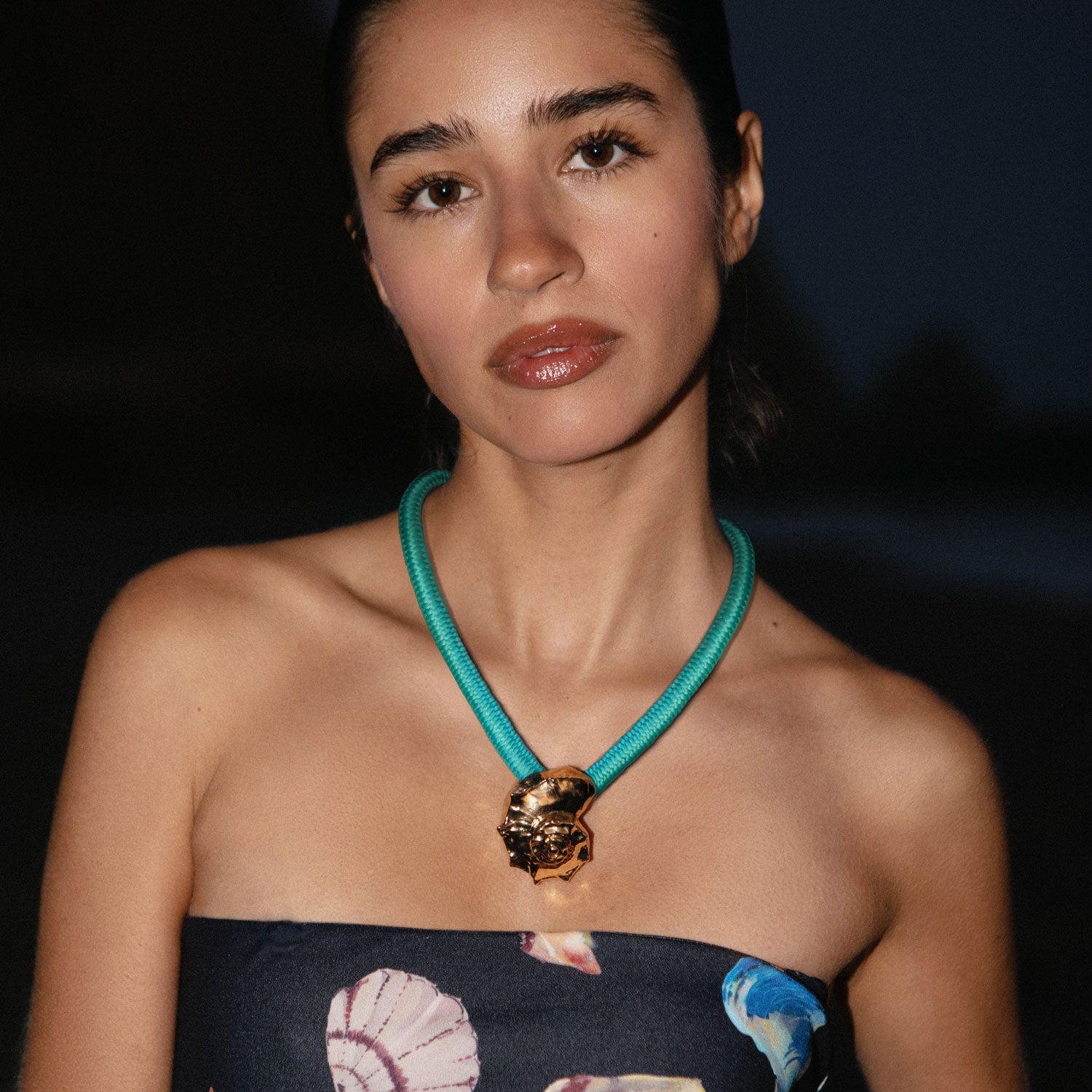 Turquoise Cord and Gold Shell Charm Pendant Necklace Styled on Model