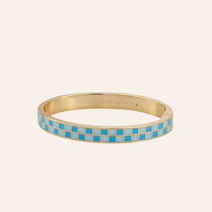 Blue Checkered Enamel Bangle Bracelet on Tan Background
