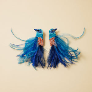 Blue Feather and Beaded Statement Feather Earrings on Flat Cream Background