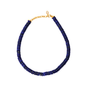Blue Beaded Strand Necklace on Flat White Background