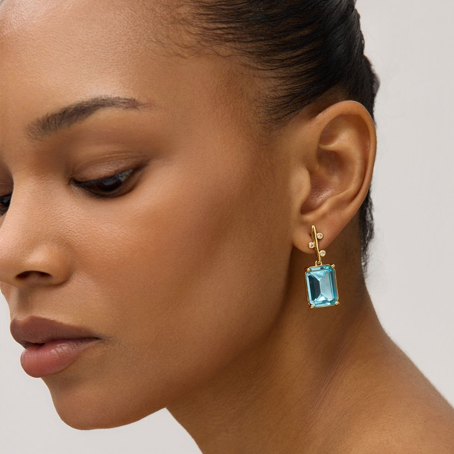 Blue, Green, and Clear Crystal Drop Earrings Styled on Model