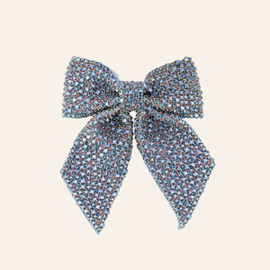 Blue and Pink Crystal Embroidered Hair Bow on Tan Background