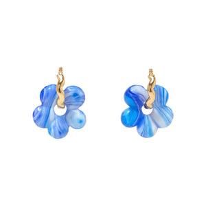 Blue and White Marbled Glass Flower Charms on Gold Hoops on Flat White Background