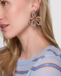 Gold beaded earrings on model
