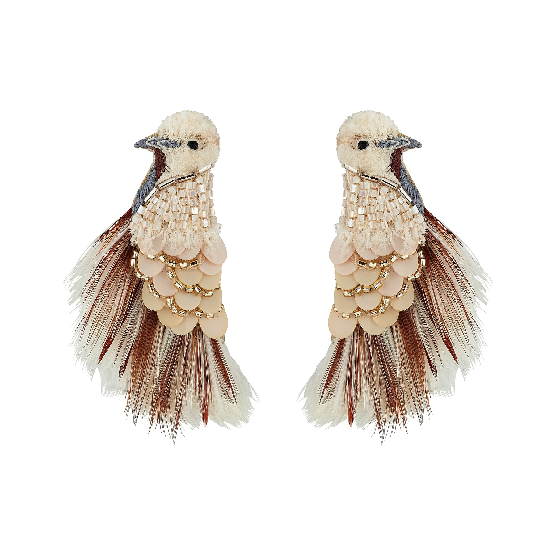 A pair of statement earrings shaped like birds, featuring cream-colored feathers, scalloped beige and gold beadwork, and dark brown feather accents, set against a plain white background.