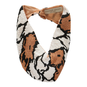 Brown, Black, and White Beaded Scarf Necklace on Flat White Background