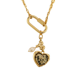 Stone, Pearl, and Gold Charm Pendant Necklace on Flat White Background